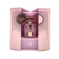 Haya Lattafa pink fragrance spray elegant packaging white background closeup side