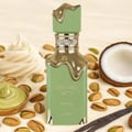 Eclaire Pistache Lattafa green fragrance surrounded nuts vanilla cream coconut setting