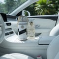 Musk Mood Lattafa edp unisex glass bottle white in car sunny green