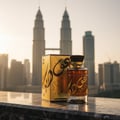 Oudain Lattafa perfume depan skyline Kuala Lumpur pandangan sunset atas