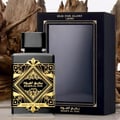 Badee Al Oud for Glory Lattafa black gold fragrance white surface wooden pieces
