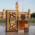 Lattafa simply oud eau de parfum in front of a building background photo shoot closeup