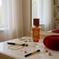 Ana Abiyedh Scarlet Lattafa edp women on vanity table surrounded accessories makeup jewellery