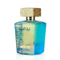 Lattafa Sheikh Al Shuyukh Supreme by Lattafa 100ml — A blue box with Arabic calligraphy and a portrait of a man in a headscarf is next to a clear glass perfume bottle with a gold textured cap and light green liquid. | Lattafa Sheikh Al Shuyukh Supreme by Lattafa 100ml — Kotak biru dengan kaligrafi Arab dan potret