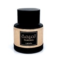 Lattafa Tamima 100ml Eau de Parfum — A black perfume bottle with a wooden cap and a rose gold label sits next to its matching black textured box with rose gold Arabic calligraphy and text. | Lattafa Tamima 100ml Eau de Parfum — Botol minyak wangi hitam dengan penutup kayu dan label emas mawar duduk bersebelahan dengan